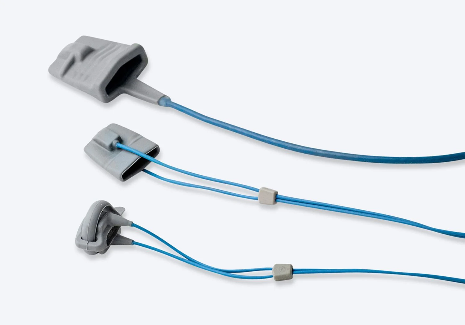 Tre grå syremätare i olika storlekar.